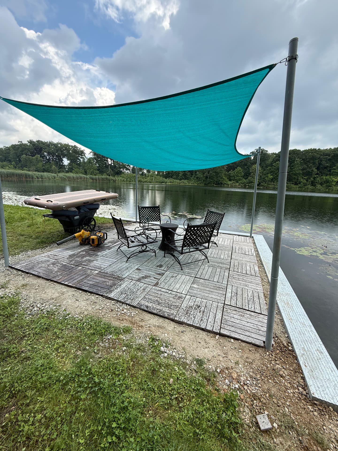 Lakeside platform with shade sail and seating